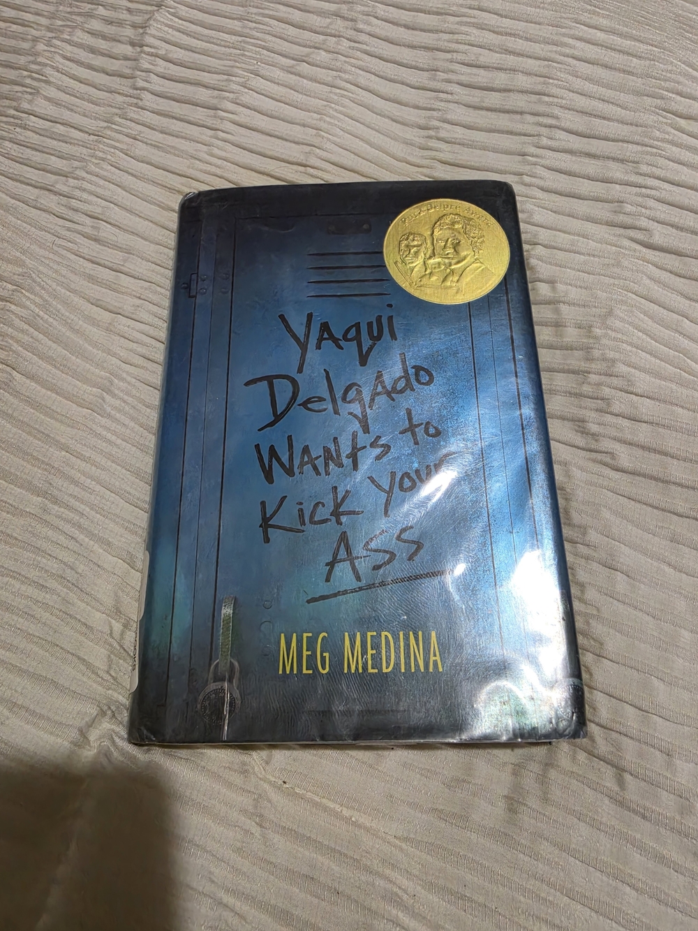 Yaqui Delgado Wants to Kick Your Ass by Meg Medina - Blue Hardcover